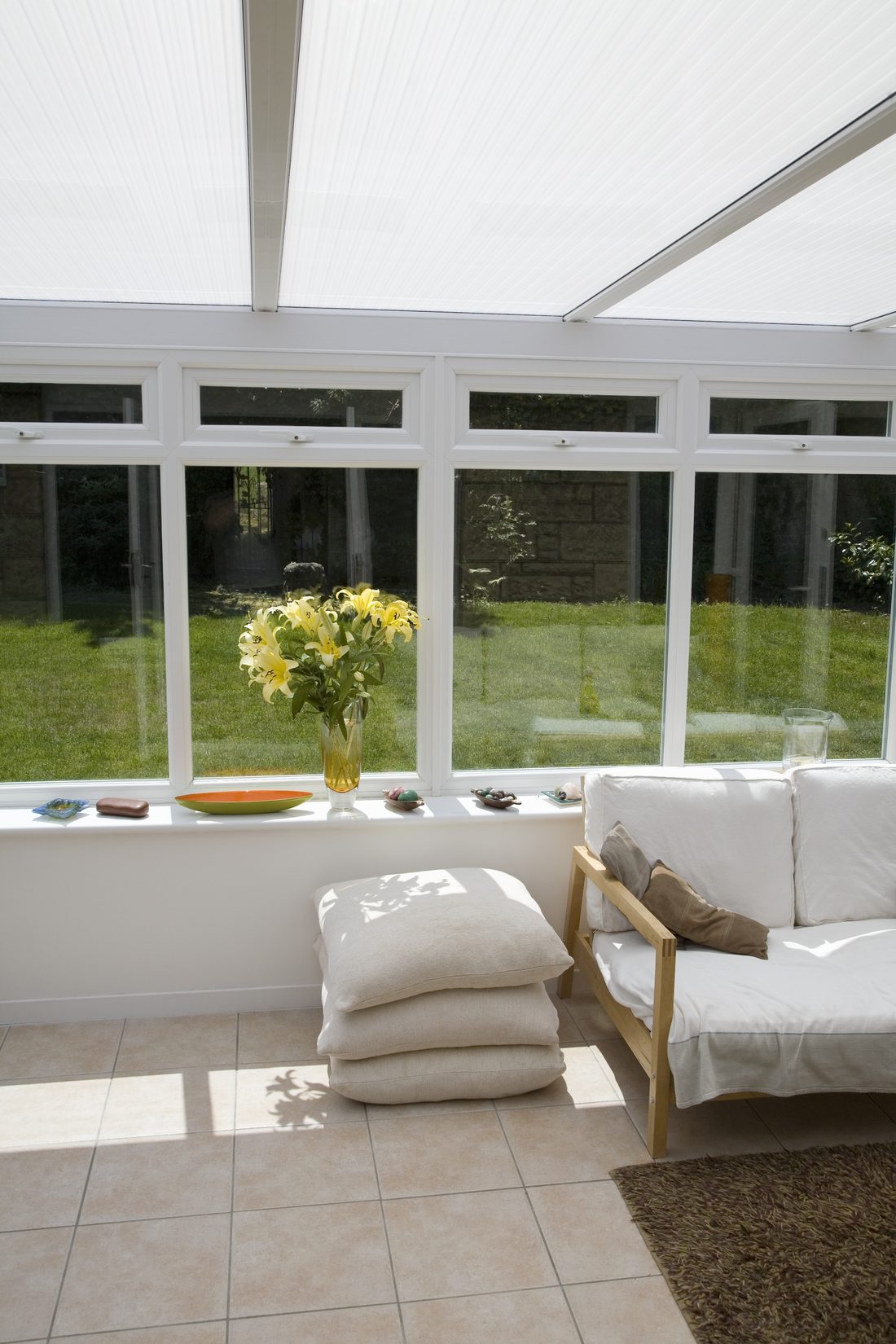 A bright sunroom framed by new windows