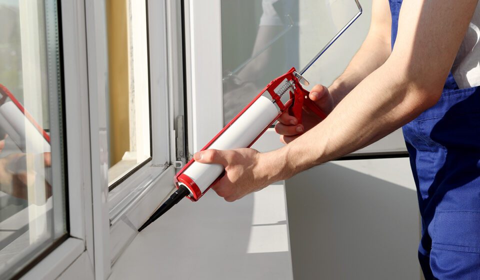 Professional installation - sealing a new window frame by hand